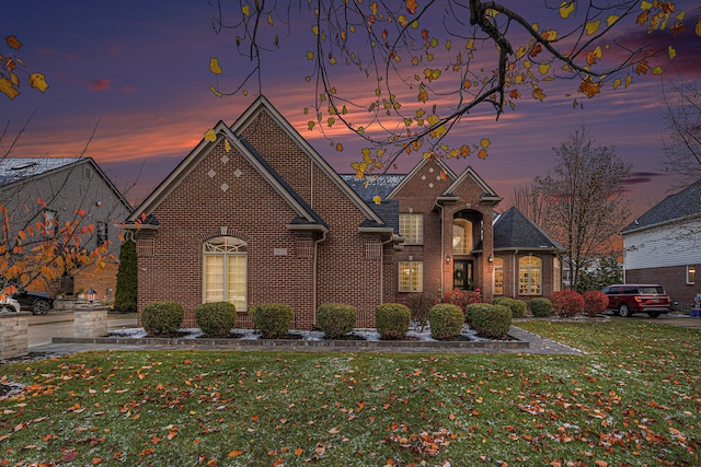 view of front of home with a lawn