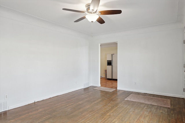 spare room with wood-type flooring and ceiling fan