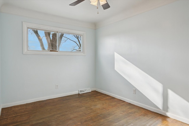 unfurnished room with dark wood-type flooring and ceiling fan