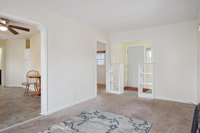 carpeted empty room with ceiling fan