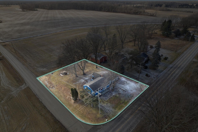 birds eye view of property with a rural view