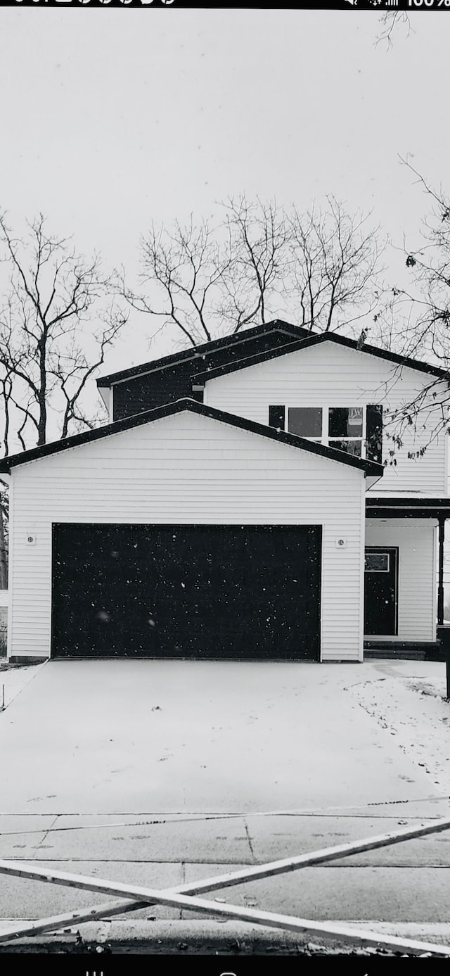 view of snow covered garage