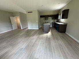 unfurnished living room with light wood-type flooring