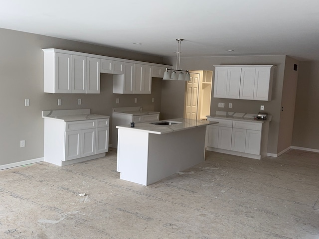 kitchen featuring white cabinetry and a center island