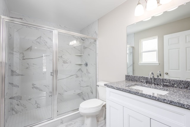 bathroom featuring marble finish floor, vanity, a marble finish shower, and toilet