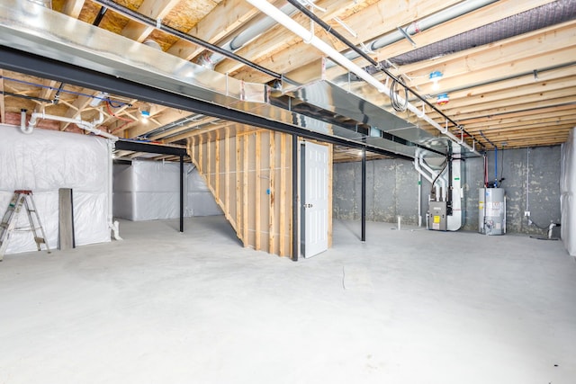 unfinished basement featuring water heater and heating unit