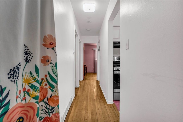 hallway featuring light hardwood / wood-style flooring