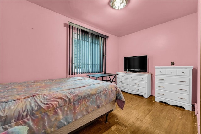 bedroom featuring hardwood / wood-style floors