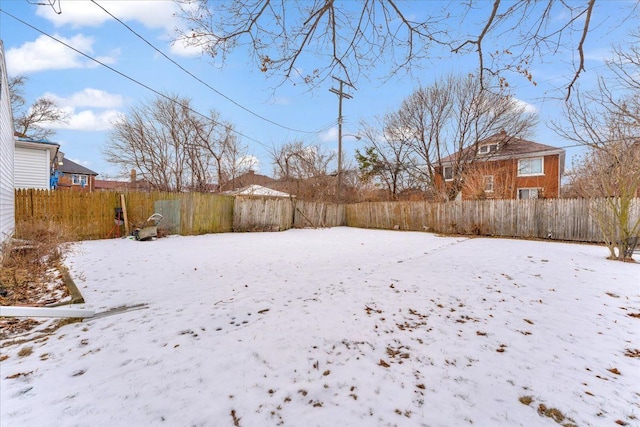 view of yard layered in snow