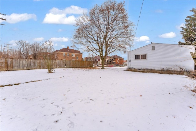 view of yard layered in snow