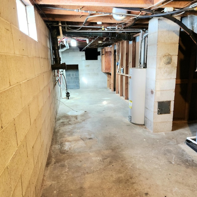 unfinished below grade area featuring gas water heater