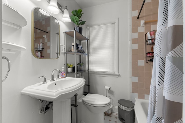 bathroom with shower / tub combo with curtain and toilet