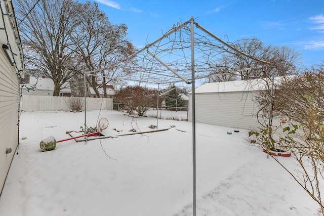 view of yard layered in snow