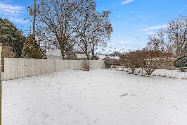 view of yard covered in snow