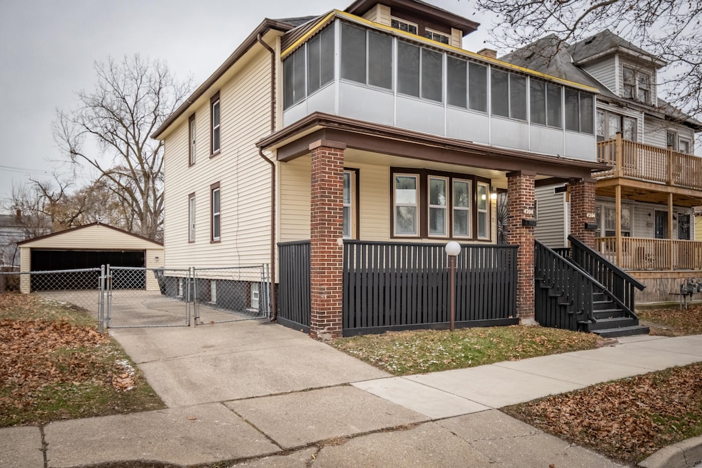 view of front of property featuring a carport and covered porch