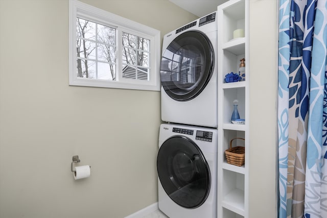 washroom with stacked washer / dryer