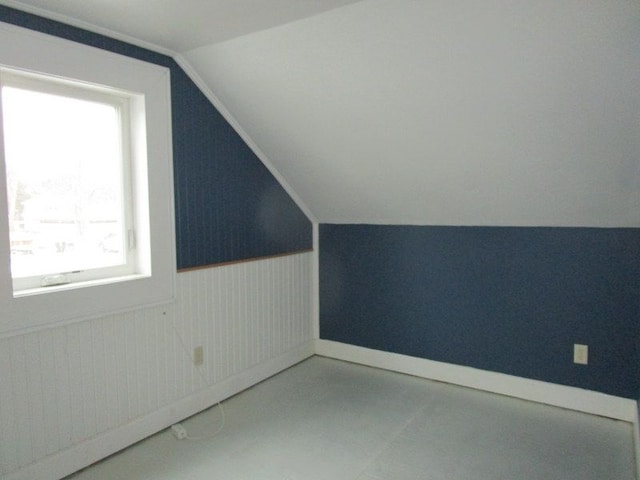 124 Roselawn St, Algonac, MI 48001 - additional living space featuring healthy amount of natural light, lofted ceiling, wainscoting, and baseboards
