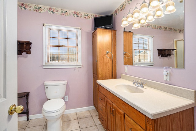 bathroom featuring tile patterned flooring, vanity, and toilet