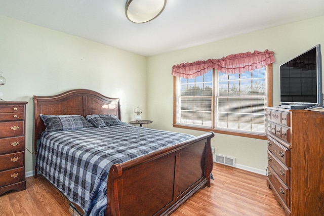 bedroom with light wood-type flooring