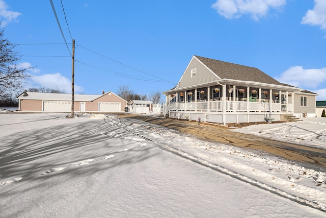 view of front of home featuring a garage and covered porch