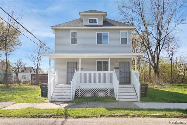 view of front of house with a porch and a front yard