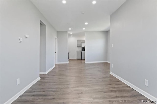 spare room featuring wood-type flooring