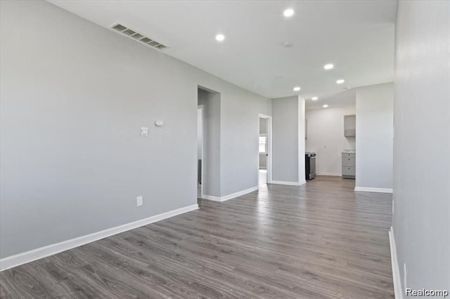 spare room featuring hardwood / wood-style flooring