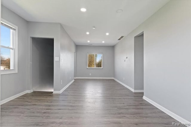 empty room with hardwood / wood-style floors