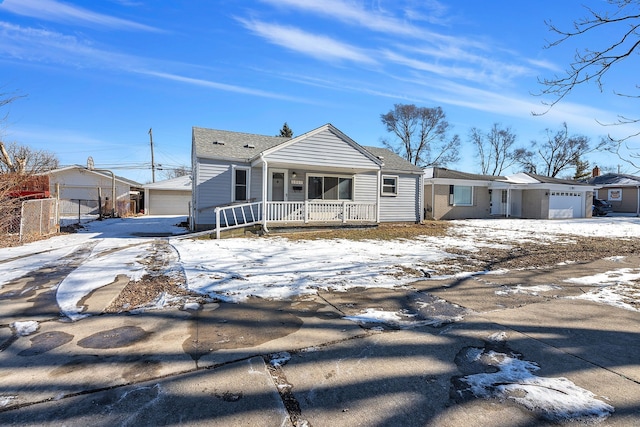 view of front of property featuring a porch and a garage