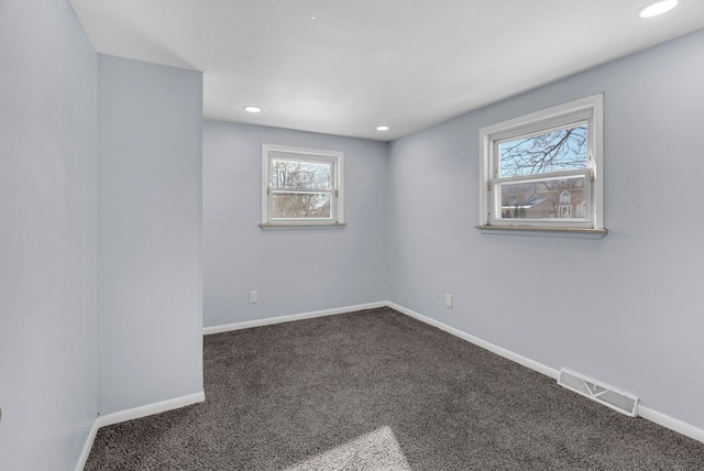 unfurnished room featuring carpet floors