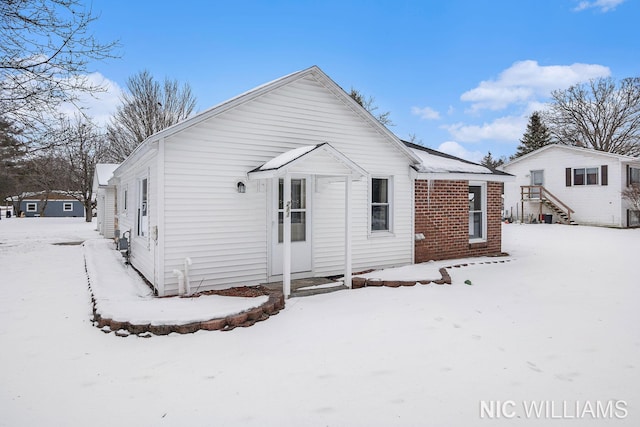 view of snow covered house