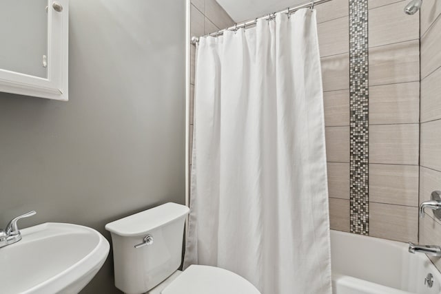 full bathroom featuring shower / tub combo, sink, and toilet