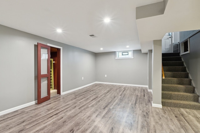 basement featuring light wood-type flooring