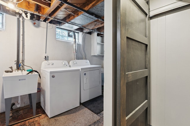 laundry area with sink and independent washer and dryer