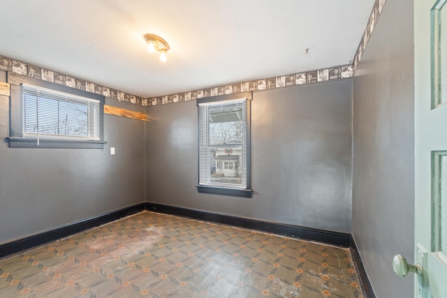 626 Orange St, Jackson, MI 49202 - spare room with baseboards