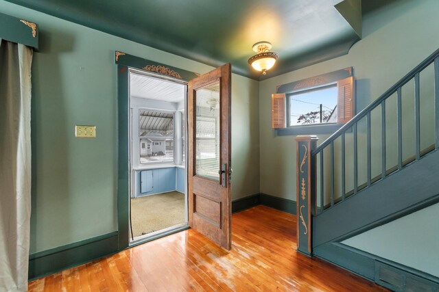 626 Orange St, Jackson, MI 49202 - entryway featuring hardwood / wood-style floors, stairway, and baseboards