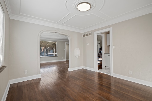 spare room with wood-type flooring and ornamental molding