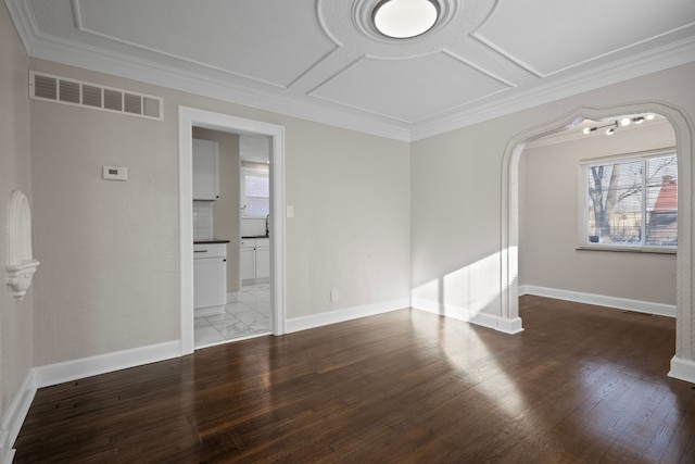 unfurnished room featuring hardwood / wood-style floors and ornamental molding