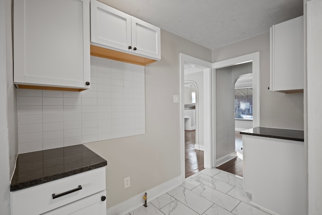 kitchen with white cabinets