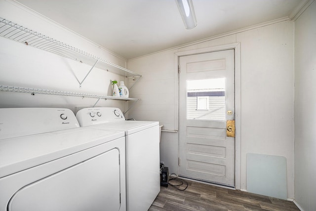 washroom with independent washer and dryer, ornamental molding, and dark hardwood / wood-style floors