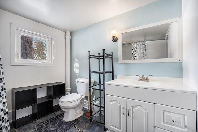 bathroom featuring vanity, a shower with shower curtain, and toilet