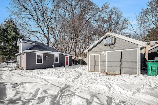 exterior space with a garage and an outdoor structure