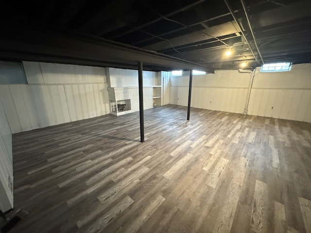 basement featuring dark hardwood / wood-style floors