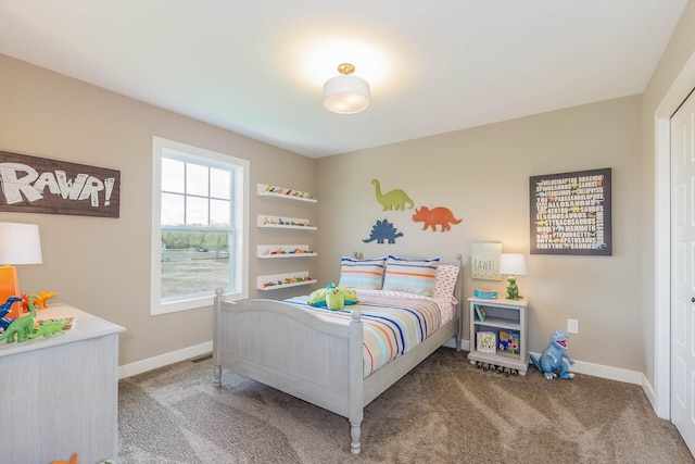 bedroom featuring carpet floors and baseboards