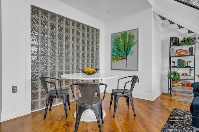 dining area with hardwood / wood-style floors
