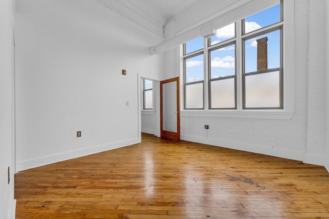 unfurnished room with light hardwood / wood-style floors