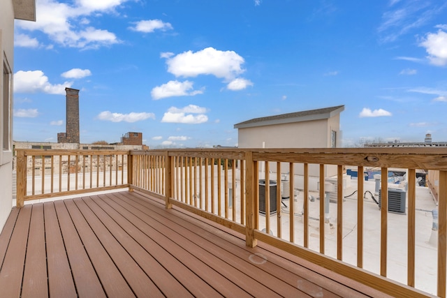 wooden deck with central air condition unit