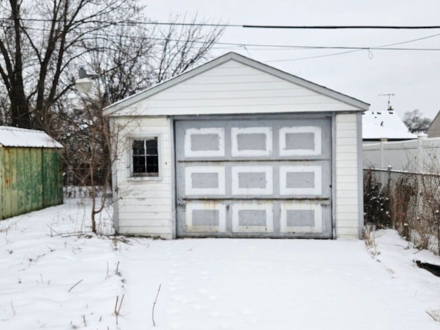 view of snow covered garage