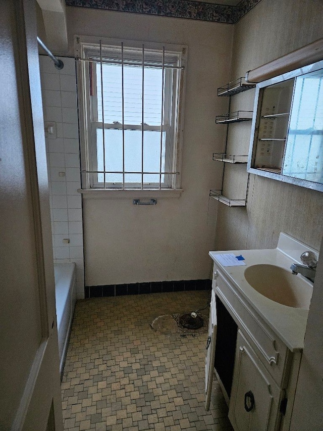 bathroom featuring vanity and tub / shower combination