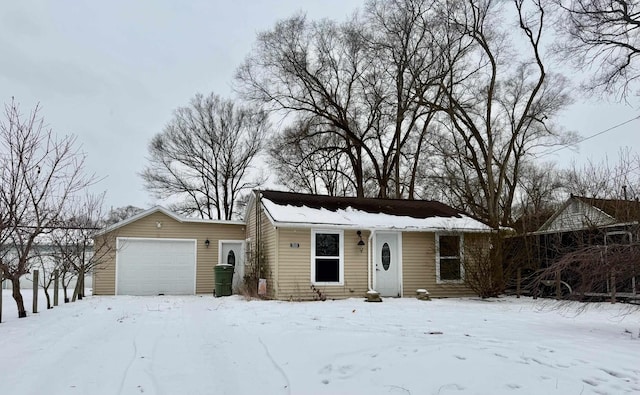 single story home featuring a garage